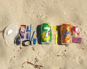 plastic waste trash on sandy beach