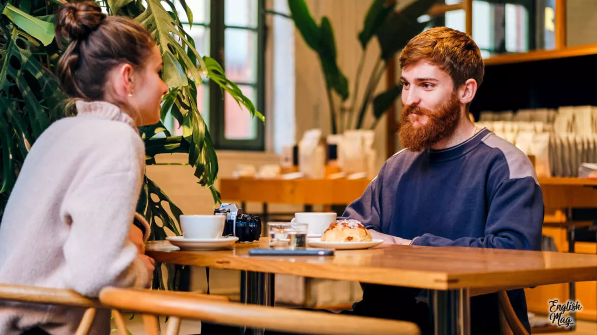 Young attractive couple drinking coffee resting together in cafe Young attractive couple drinking coffee